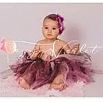 Eyelash, Picture Frame, Purple, Dress, Baby & Toddler Clothing, Petal, Rose, Violet, Happy, Mythical Creature, Magenta, Headpiece, Font, Jewellery, Headband, Bambin, Baby, Event, Fashion Accessory, Personne