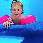 Enfant, Visage, Rose, Bleu, Peau, Bambin, Fun, Baby, Leisure, Aqua, Sourire, Turquoise, Swimming Pool, Summer, Recreation, Games, Play, Inflatable, Baby Products, Personne