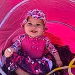 Purple, Dress, Textile, Rose, Violet, Happy, Magenta, Sourire, Bambin, Fun, Pattern, Baby, Leisure, Event, Enfant, Baby & Toddler Clothing, Peach, Baby Products, Tradition, Assis, Personne, Joy, Headwear