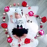 Head, Bras, Blanc, Human Body, Neck, Textile, Sleeve, Rose, Headgear, Font, Red, Baby & Toddler Clothing, Petal, Jewellery, Pattern, Heart, Happy, Magenta, Hair Accessory, Picture Frame, Personne, Headwear