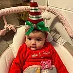Cap, Costume Hat, Baby & Toddler Clothing, Headgear, Happy, Cone, Baby, Bambin, Event, Holiday, Christmas Decoration, Fictional Character, Christmas Ornament, Tradition, Chapi Chapo, NoÃ«l, Fun, Room, Christmas Eve, Beanie, Personne