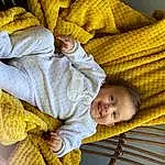 Joue, Peau, Head, Photograph, Comfort, Sourire, Textile, Yellow, Baby, Baby Sleeping, Bambin, Bois, Linens, Baby & Toddler Clothing, Happy, Enfant, People In Nature, Pattern, Personne, Joy