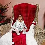 Meubles, Blanc, Comfort, Plante, Chair, Christmas Tree, Red, Baby & Toddler Clothing, Baby, Bambin, Lap, Event, Pattern, Assis, Room, Magenta, Christmas Decoration, Carmine, Holiday, Outdoor Furniture, Personne