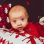 Head, Yeux, Sleeve, Baby, Baby & Toddler Clothing, Red, Happy, Bambin, Event, Holiday, Fun, Enfant, Assis, Linens, NoÃ«l, Carmine, Christmas Eve, Portrait Photography, Baby Products, Couch, Personne