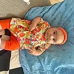 Hand, Bras, Comfort, Baby & Toddler Clothing, Human Body, Textile, Sleeve, Orange, Baby, Bambin, Sock, Linens, Enfant, Thigh, Pattern, Baby Products, Baby Sleeping, T-shirt, Human Leg, Personne