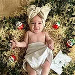 People In Nature, Baby & Toddler Clothing, Herbe, Happy, Faon, Plante, Baby, Bambin, Christmas Tree, Christmas Ornament, Headpiece, Event, Enfant, Holiday, Headband, Assis, Human Leg, Fashion Accessory, Fun, Christmas Decoration, Personne, Joy, Headwear