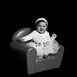 Sourire, Comfort, Flash Photography, Sleeve, Baby, Bambin, Baby & Toddler Clothing, Enfant, Baby Products, Noir & Blanc, Assis, Monochrome, Chair, Portrait, Portrait Photography, Darkness, Fun, Entertainment, Vintage Clothing, Personne, Joy