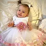 Dress, Sourire, Baby & Toddler Clothing, Flash Photography, Sleeve, Textile, Happy, Rose, Embellishment, Bambin, Baby, Day Dress, Bridal Accessory, Gown, Enfant, Headpiece, Formal Wear, Event, Ruffle, Personne