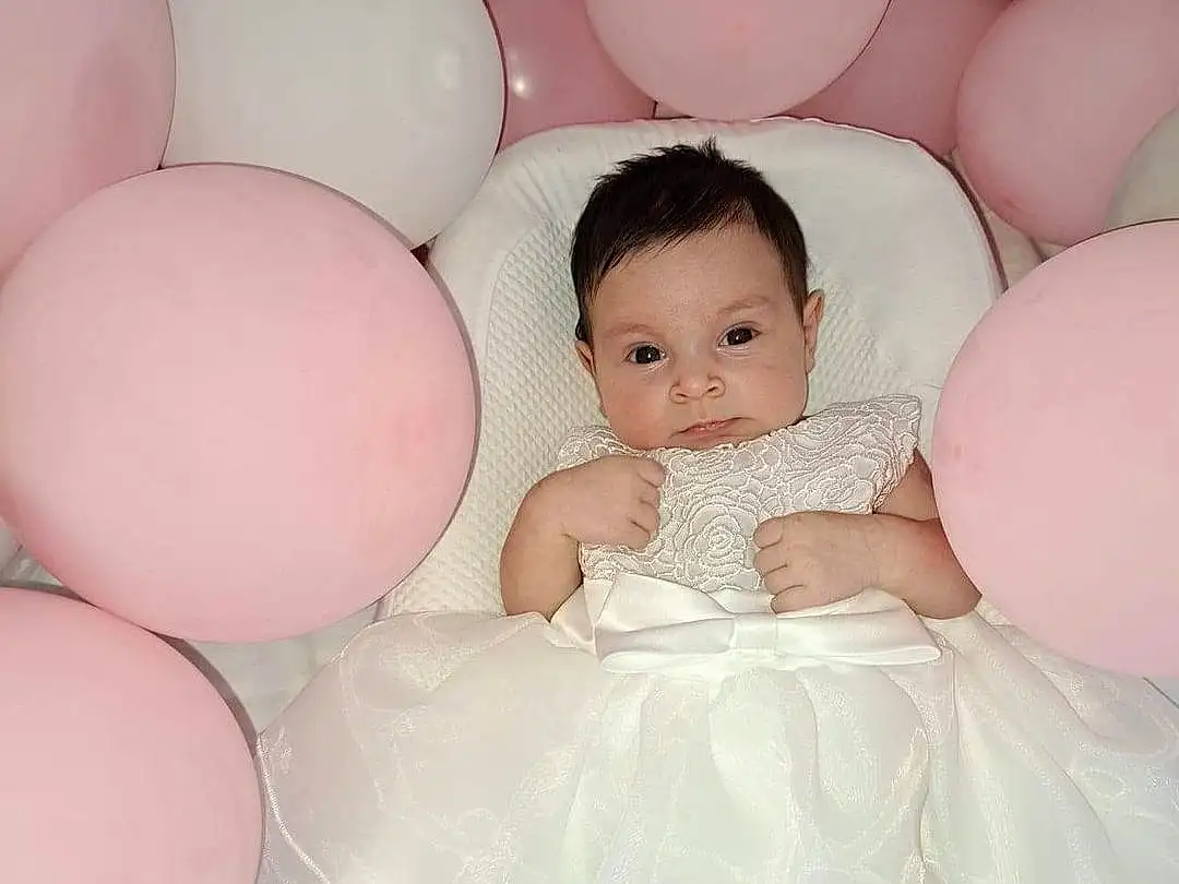 Visage, Peau, Head, Yeux, Facial Expression, Dress, Flash Photography, Textile, Happy, Wedding Dress, Gesture, Comfort, Rose, Finger, Balloon, Bridal Clothing, Baby & Toddler Clothing, Bambin, Fun, Personne